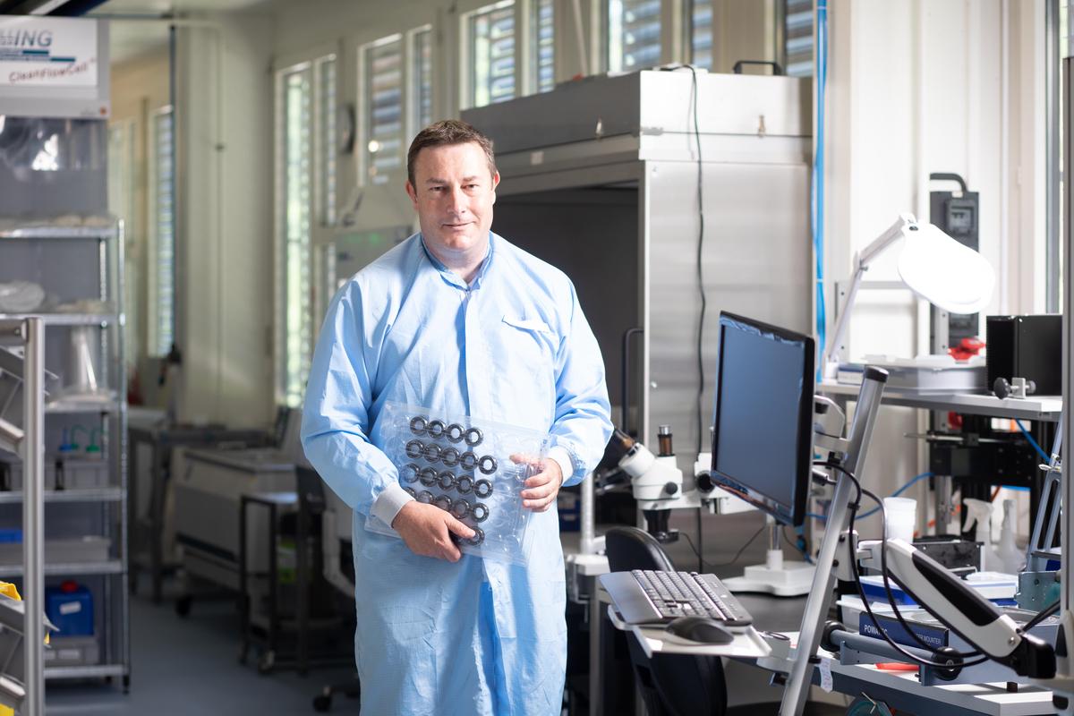 Big lenses for barcode scanners, smaller lenses for mobile phones: CEO Manuel Aschwanden at company headquarters in Dietikon with a load of Optotune lenses. 