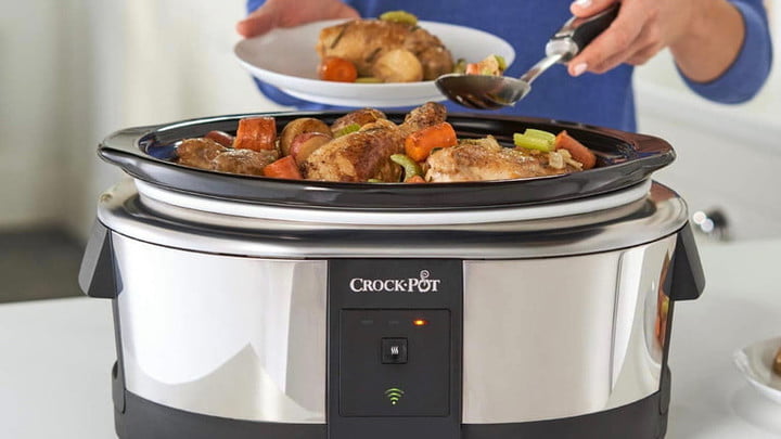 Woman serving food straight from the slow cooker.