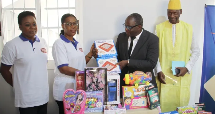 A telecom company donates many toys to children in several municipalities in Abidjan
