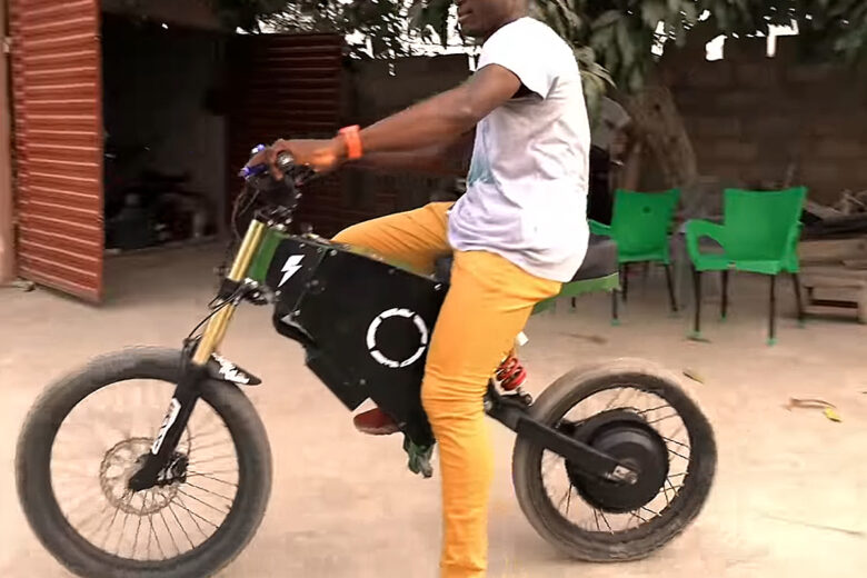 Lawrence Adji on his electric motorcycle